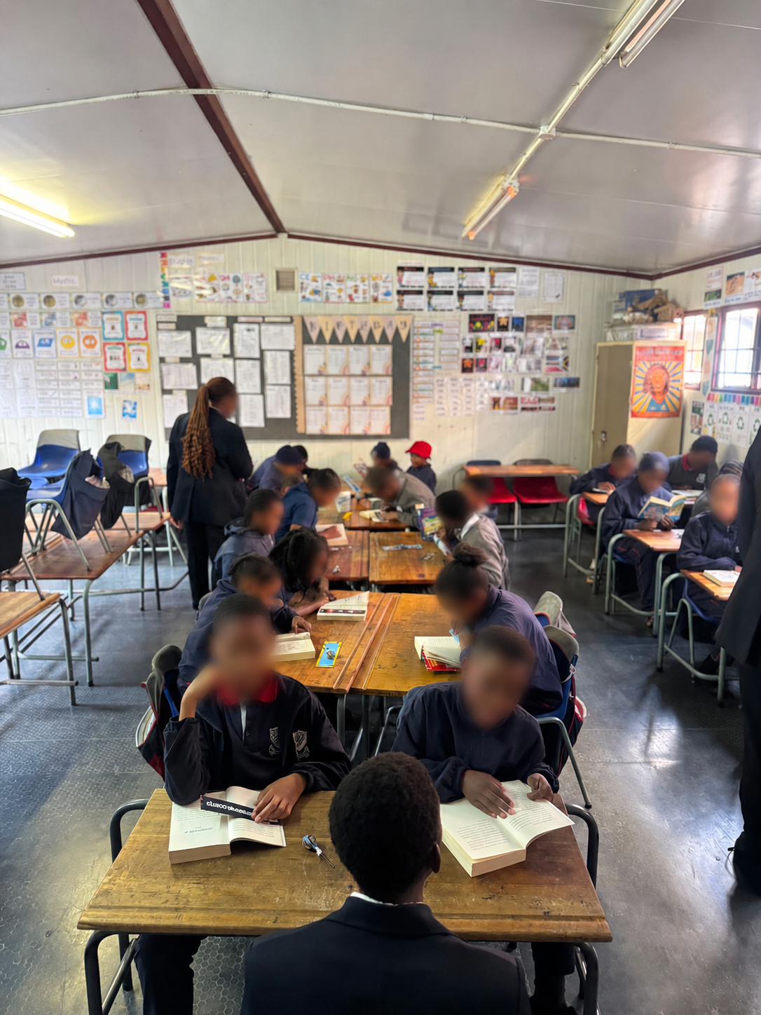 Learners reading together during Next Chapter Jozi's first school session at Berea Primary School
